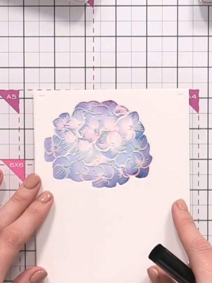 Step 5: Position stencil number three over your design and apply green ink to create the leaf details. Keep the ink ap