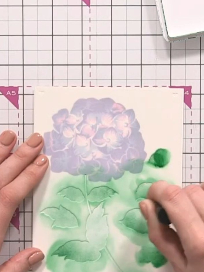 Step 7: Layer teal ink over some of the green areas using a blending tool to add additional colour interest and blend 