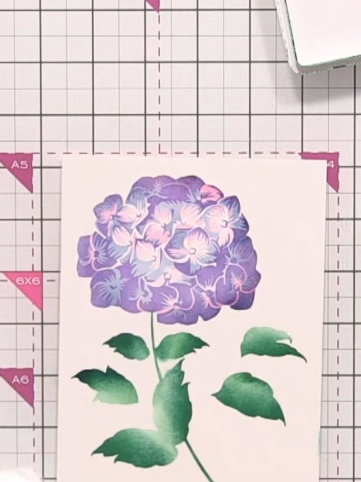Step 8: Continue layering with the remaining stencils, building up the hydrangea flower petals and foliage. Use your c