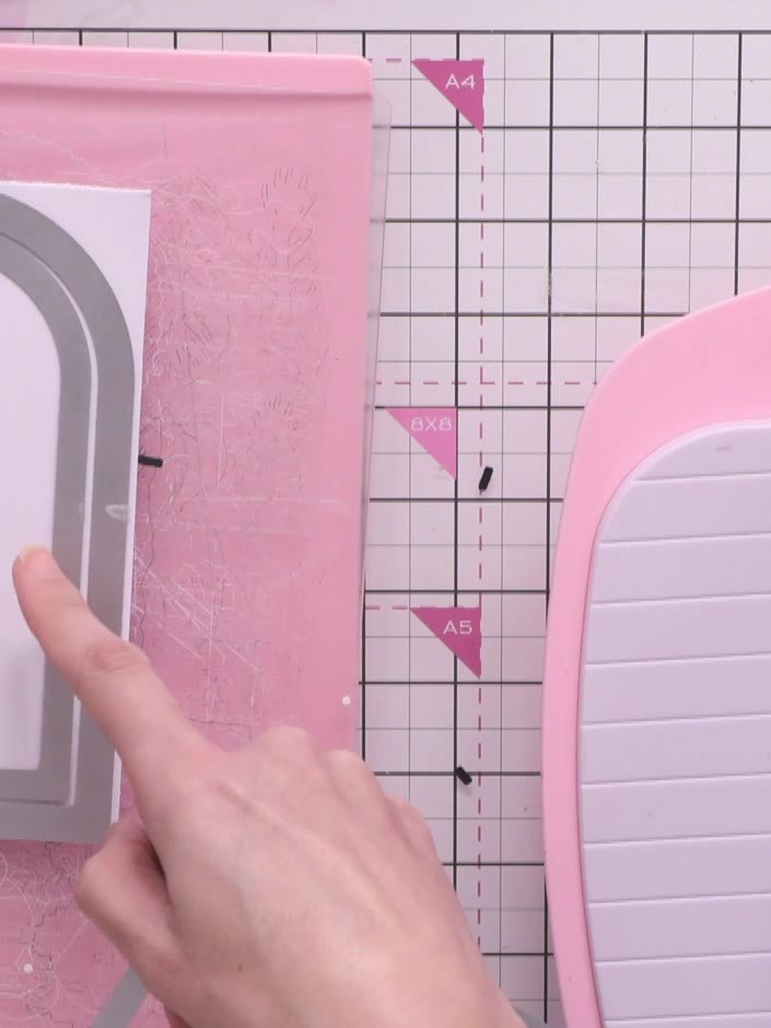Step 5: Select the next size down die from the nested set and cut it from your chosen patterned paper. Position this p