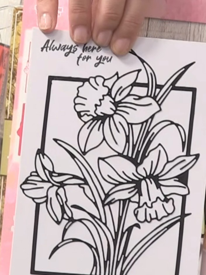 Step 1: Position the daffodil layering stencil over your card base. Apply colour through the stencil using your chosen