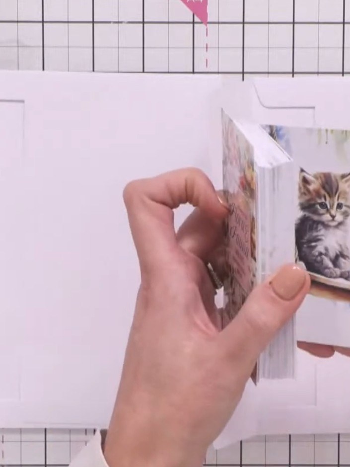 Step 1: Take two white envelopes and tuck the flap of one envelope inside the flap of the other to create a pocket pag