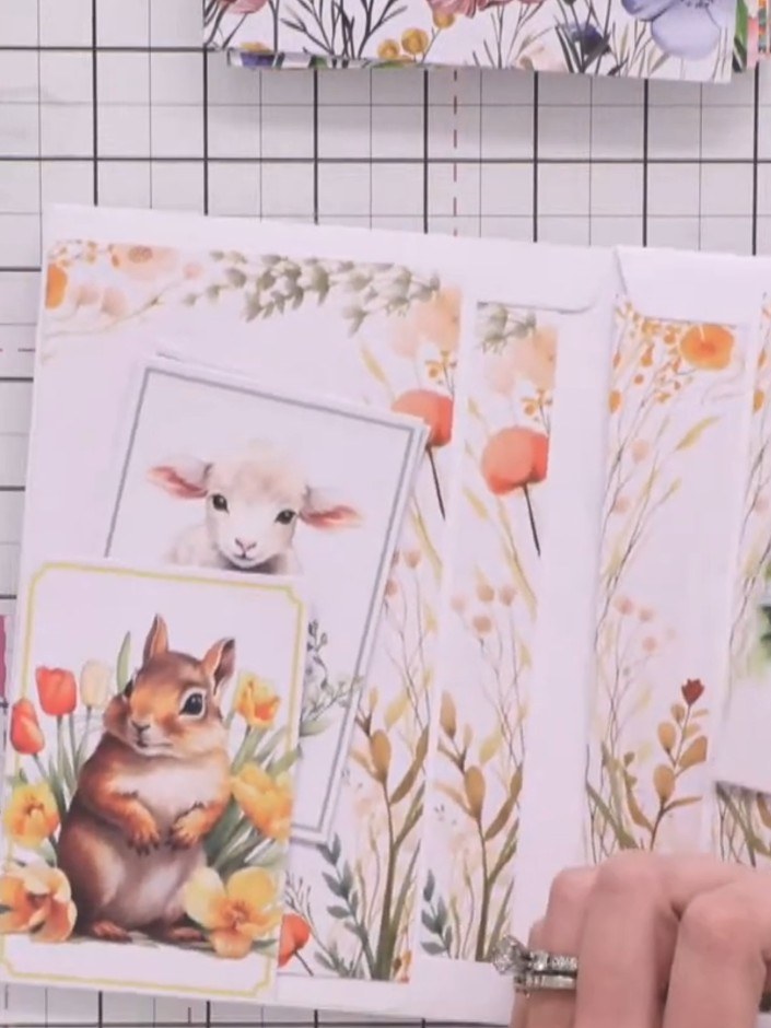 Step 12: Arrange additional decorative animal images and floral elements inside the pockets and pages. Layer the cute a