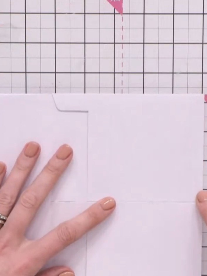Step 5: Use a Slither tool or bone folder to seal the bottom edge of the envelope pocket closed, ensuring items won't 