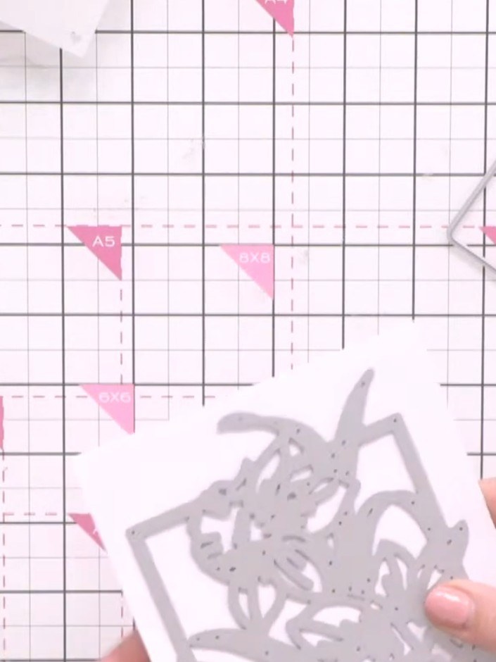 Step 1: Cut the detailed daffodil die from white cardstock using a die-cutting machine, placing a shim underneath for 