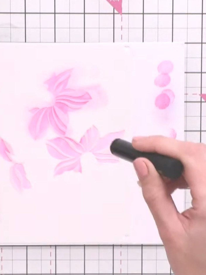 Step 7: Position stencil number two over the same area on your card. Apply slightly darker pink ink using the blending