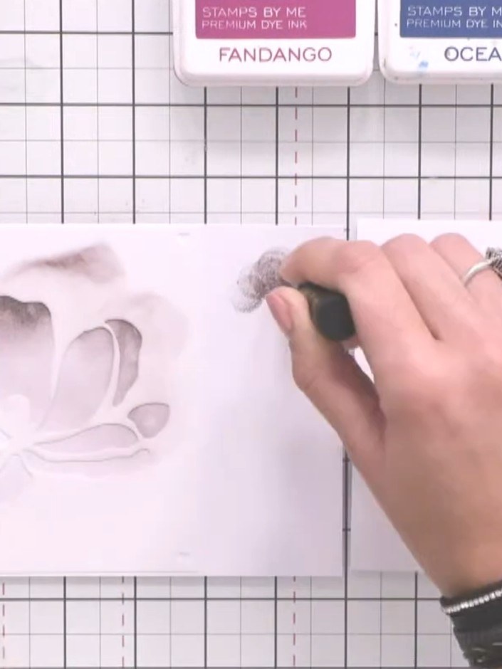 Step 2: Using a blending brush, apply Heather ink to the stencilled magnolia image. Start from the edges of the petals