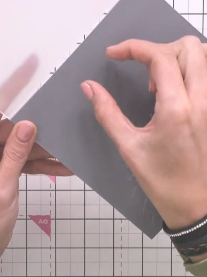 Step 2: Place your card stock into the embossing folder and run it through your die-cutting machine to emboss the sunf