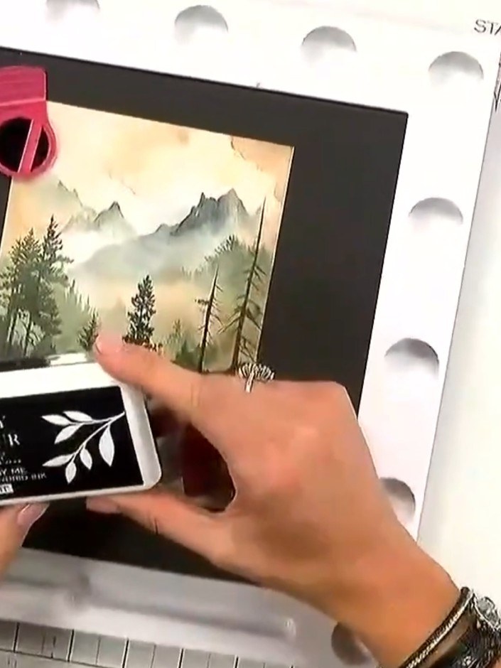 Step 2: Stamp the wolf image onto the centre of your watercolour-effect card using a dark ink pad. Press firmly to ens