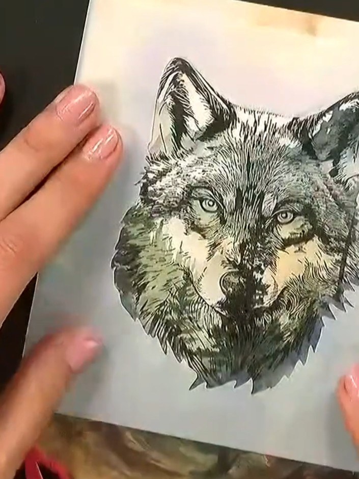 Step 7: Mount your finished wolf image onto a card blank using adhesive. The stamped and coloured design creates a str