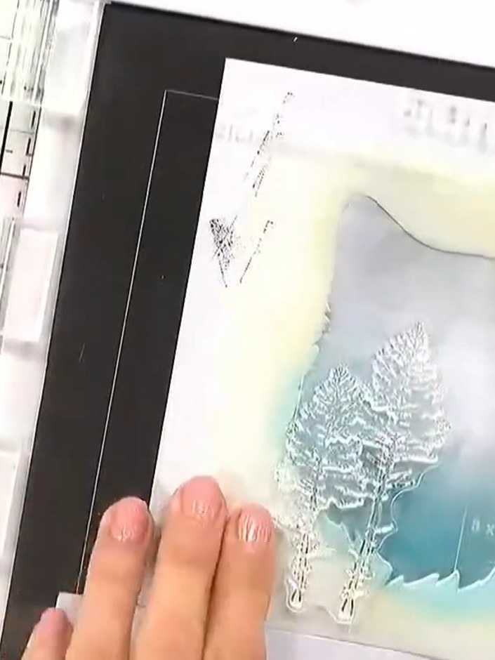 Step 1: Use the exterior stencil from the Woodland Wolf set to create a silhouette on your white card base. Apply grey