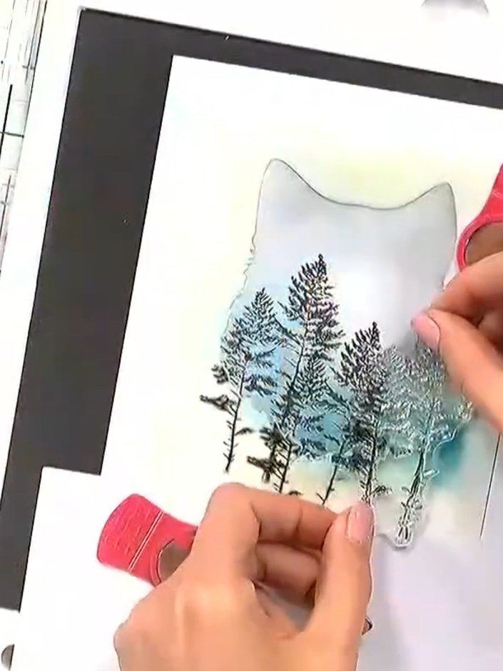 Step 5: Stamp additional trees at varying heights within the silhouette using the tree stamps. Build up a forest lands
