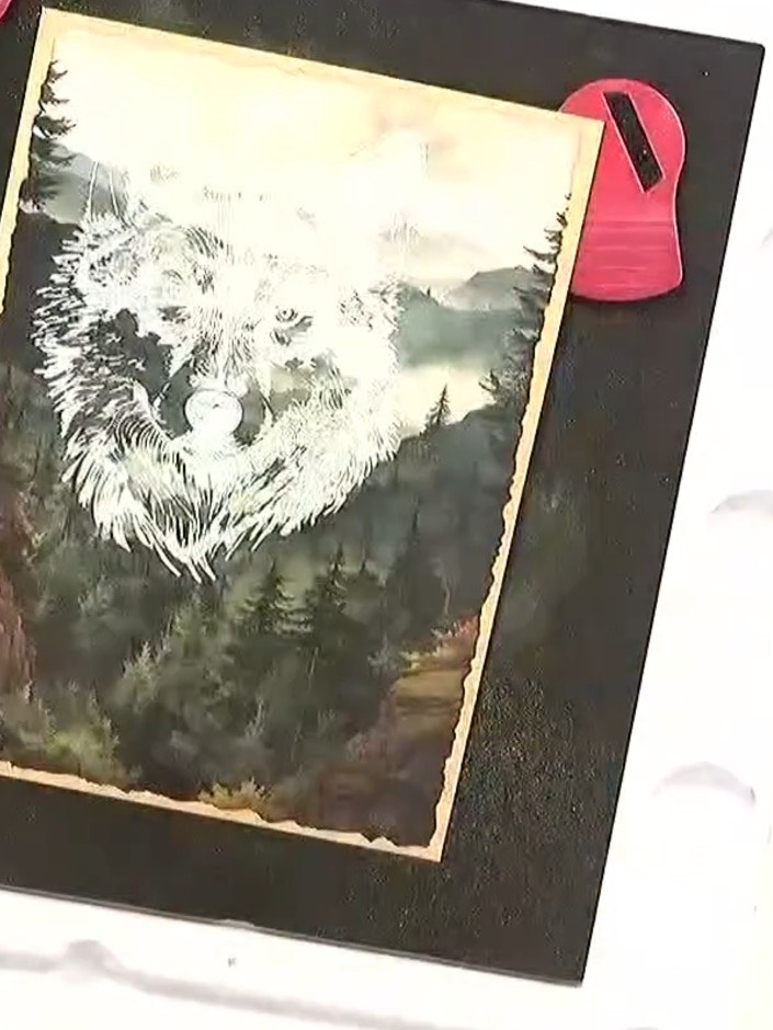 Step 5: Hold the heat tool a short distance above the card and move it gently over the embossed design until the white
