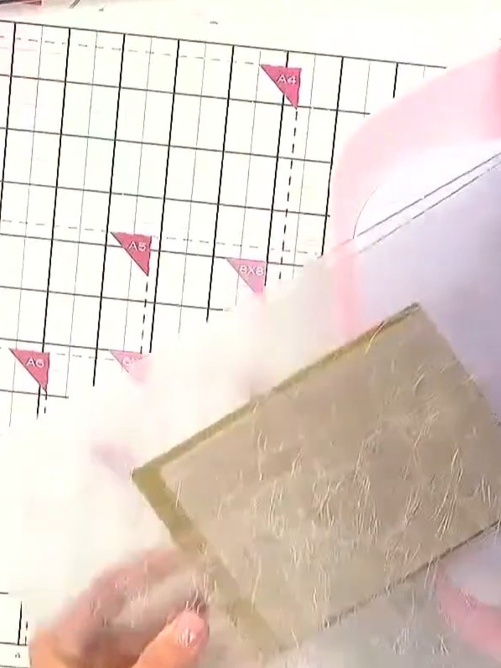 Step 3: Turn the handle of the die cutting and embossing machine smoothly and steadily to feed the card sandwich throu
