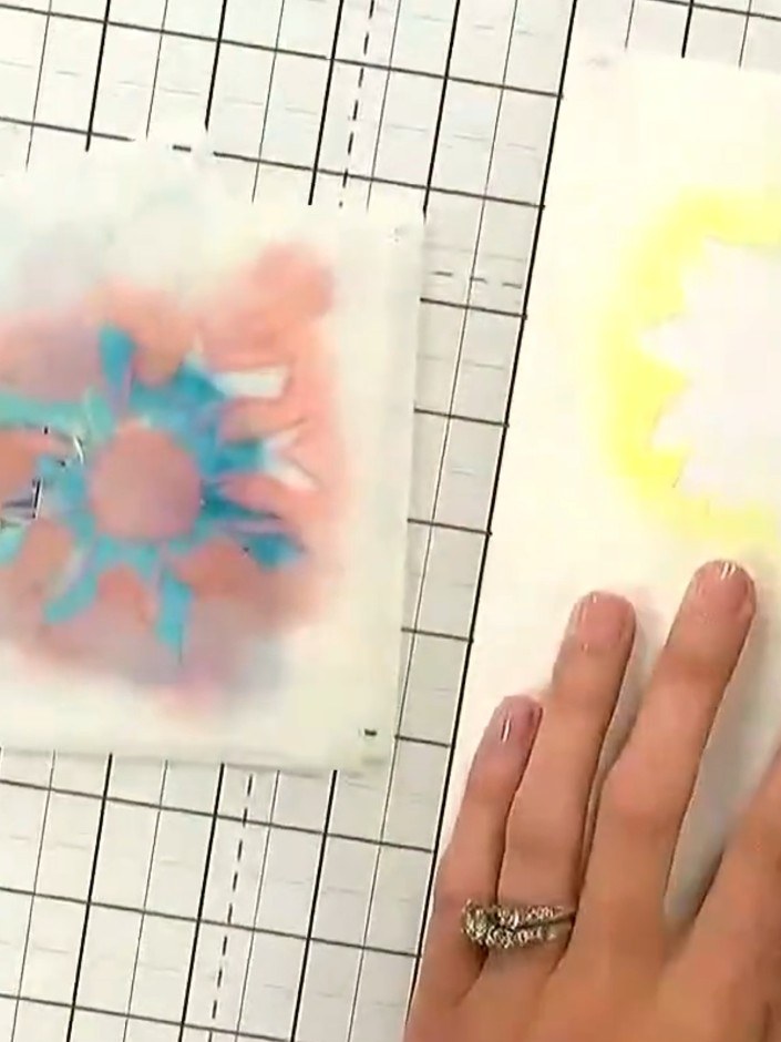 Step 1: Place your white card stock on the craft mat. Position the first stencil from the numbered layering system ove