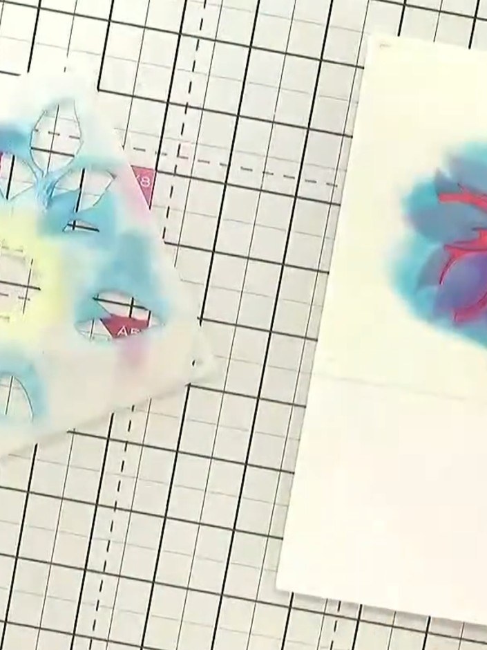 Step 6: Continue building up the layered flower design by applying stencils 3, 4, and 5. Use different colours for eac