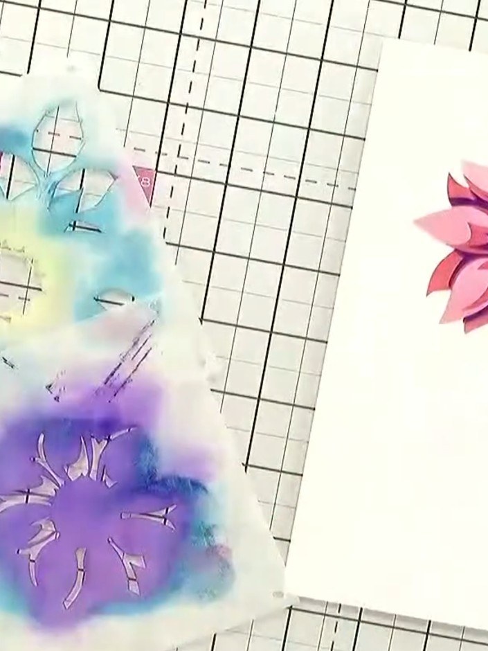 Step 8: Once all stencilled layers are dry, arrange the layered flower elements on your card base. Add any final embel
