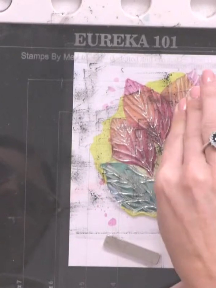 Step 2: Apply sticky embossing ink to the coloured leaf design using the embossing ink pad. Ensure even coverage acros