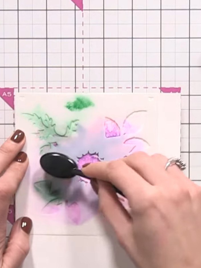 Step 10: Position stencil number 4 over your design and apply green ink using a blending tool to add leaf detail in the