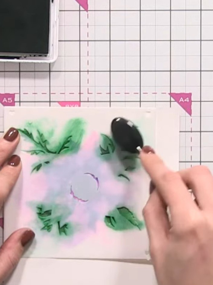 Step 12: Flick water onto the final stencil layer using your fingertips rather than spraying to create a more controlle