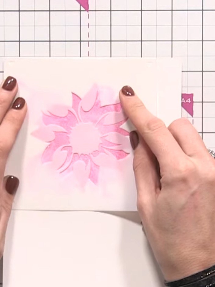 Step 6: Align stencil number 2 at the edge of your card. Using a fresh blending brush, apply purple ink through the st