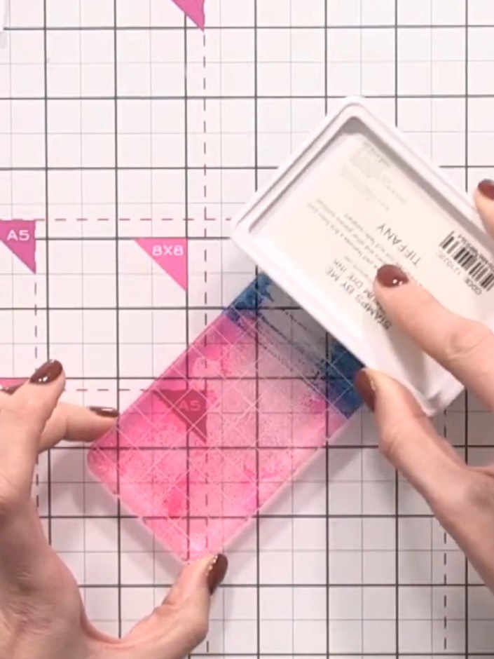 Step 3: Ink up the bottom half of the acrylic block with the second colour (teal). Position it overlapping the pink se