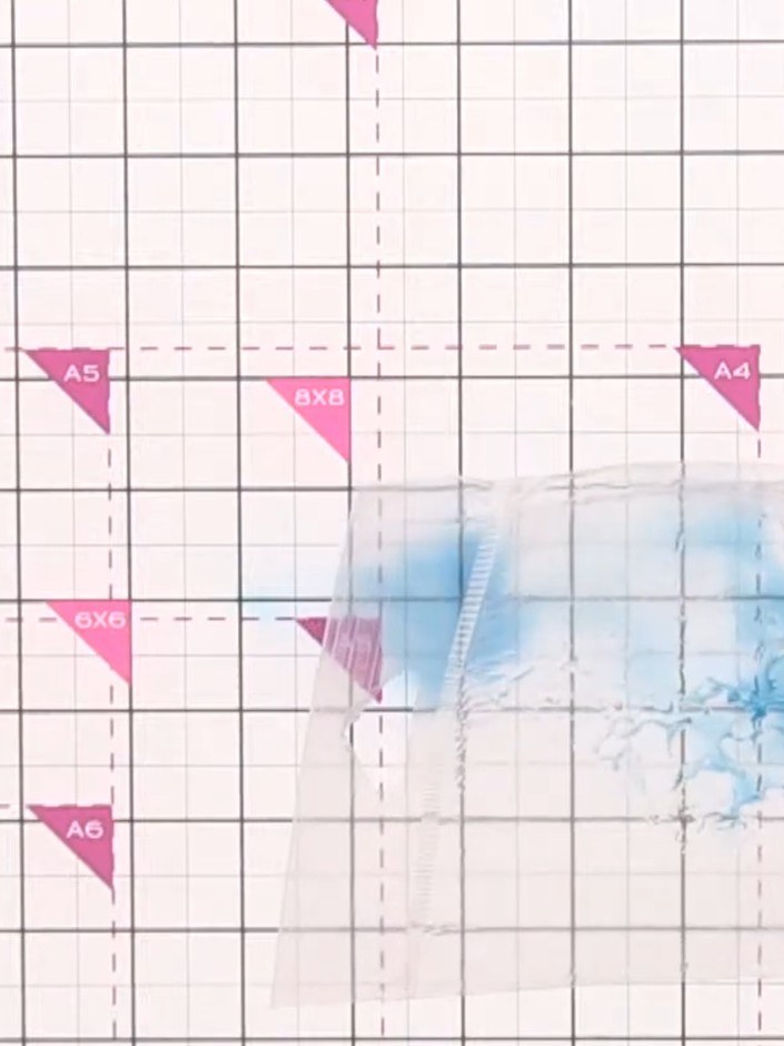 Step 3: Spray the inked craft mat with water to activate the blue ink colour. The water will help spread and blend the