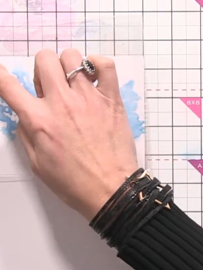 Step 5: Transfer the inked cellophane bag onto your white card blank by pressing and tapping it down firmly to create 