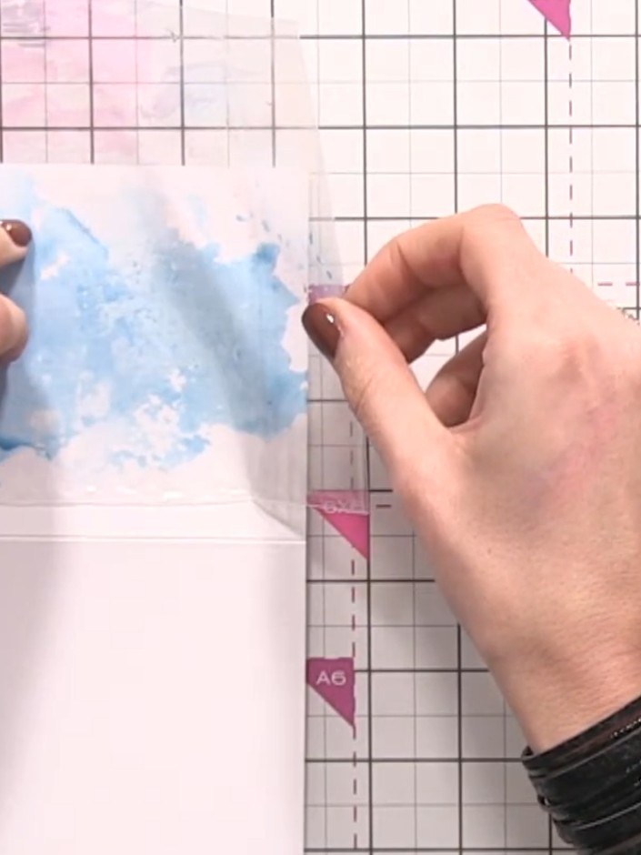 Step 7: Add yellow ink to the cellophane bag using the same technique. Press the inked cellophane onto the card to tra