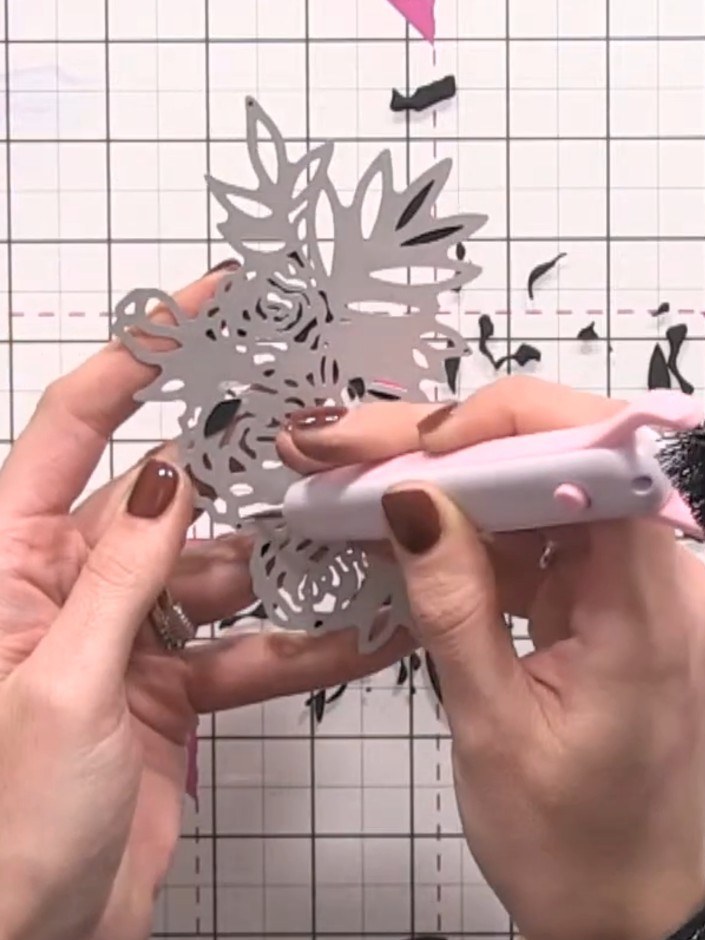 Step 10: Use a pokey tool to carefully pop out the detailed pieces from the die-cut rose. Remove all the small intricat
