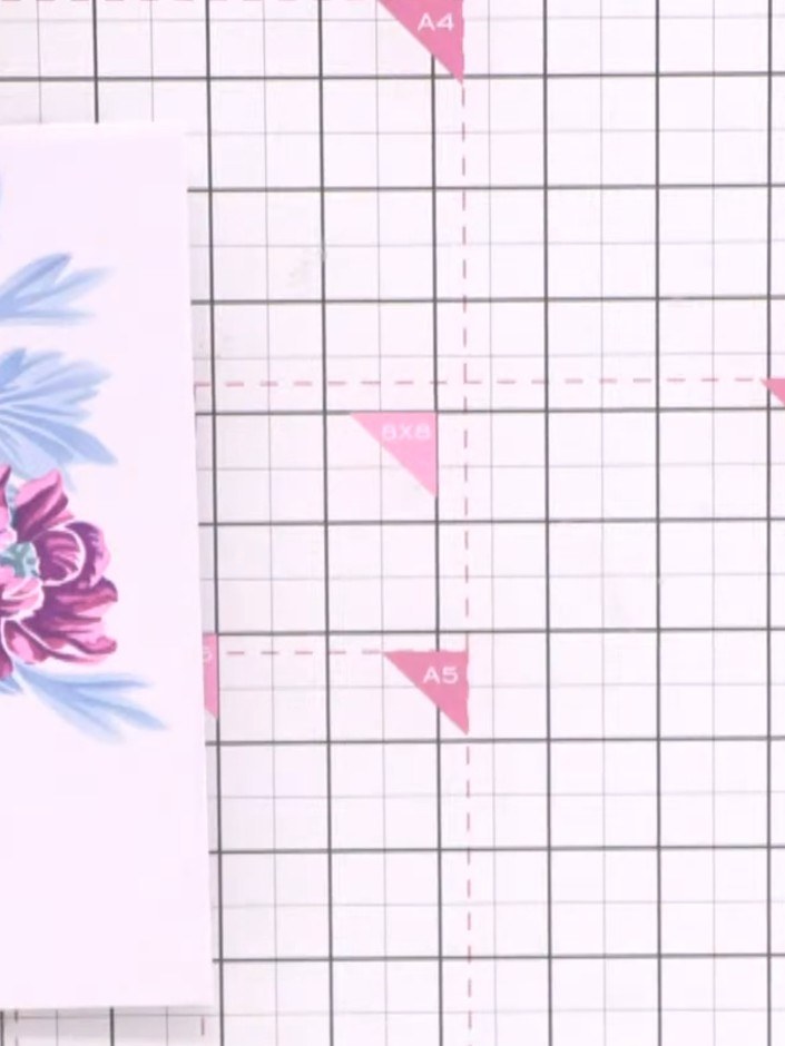 Step 2: Position stencil number one in the corner of your card base. Using a blending brush, blend pink ink through th