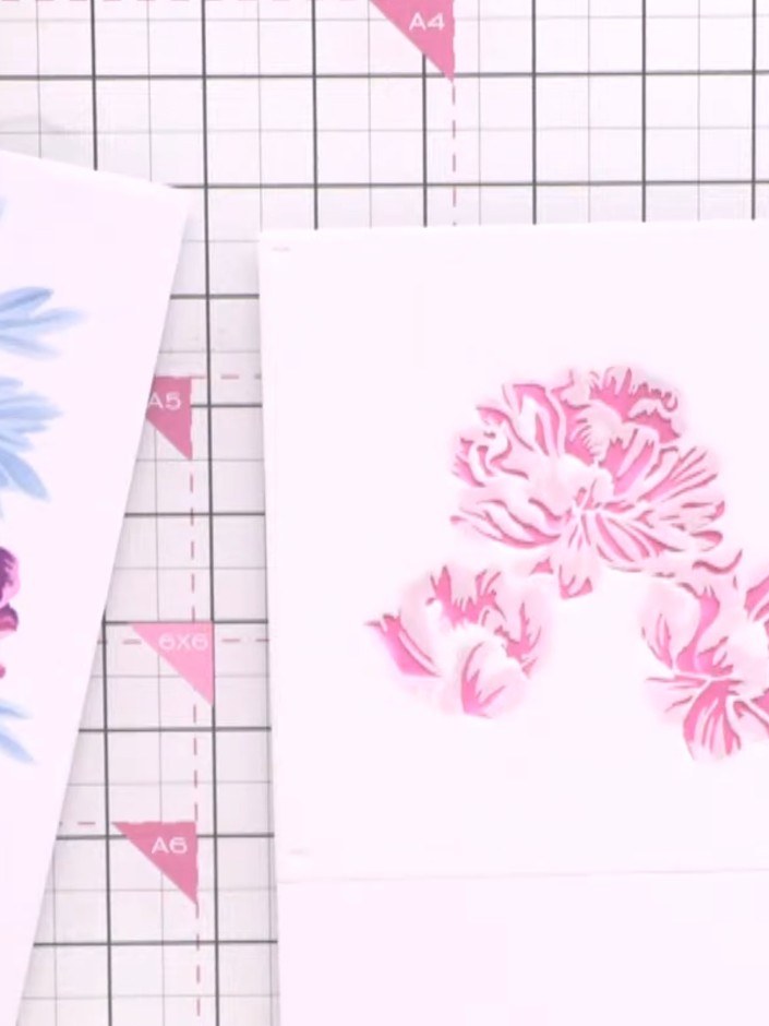 Step 4: Position stencil number three over your card. Using orange ink, apply colour through the stencil to add variat
