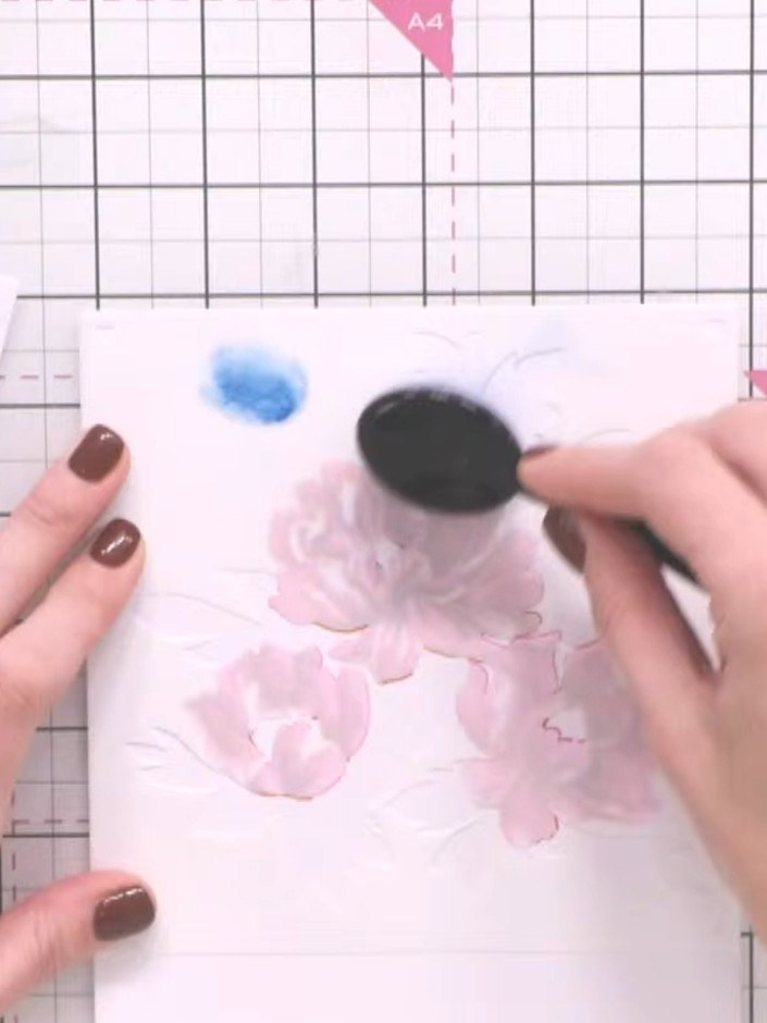 Step 6: Apply stencil number six over the design. Blend ink through the stencil using the blending tool to complete th