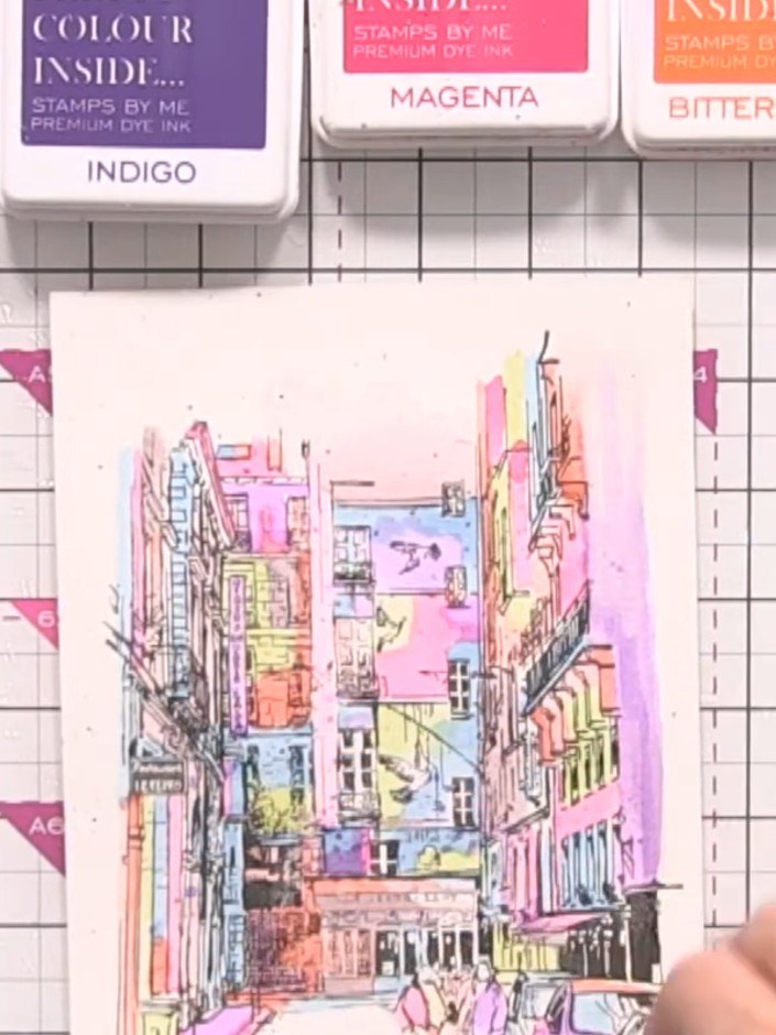 Step 8: Sprinkle water across the painted cityscape design and allow it to sit briefly. Gently mop up the excess water