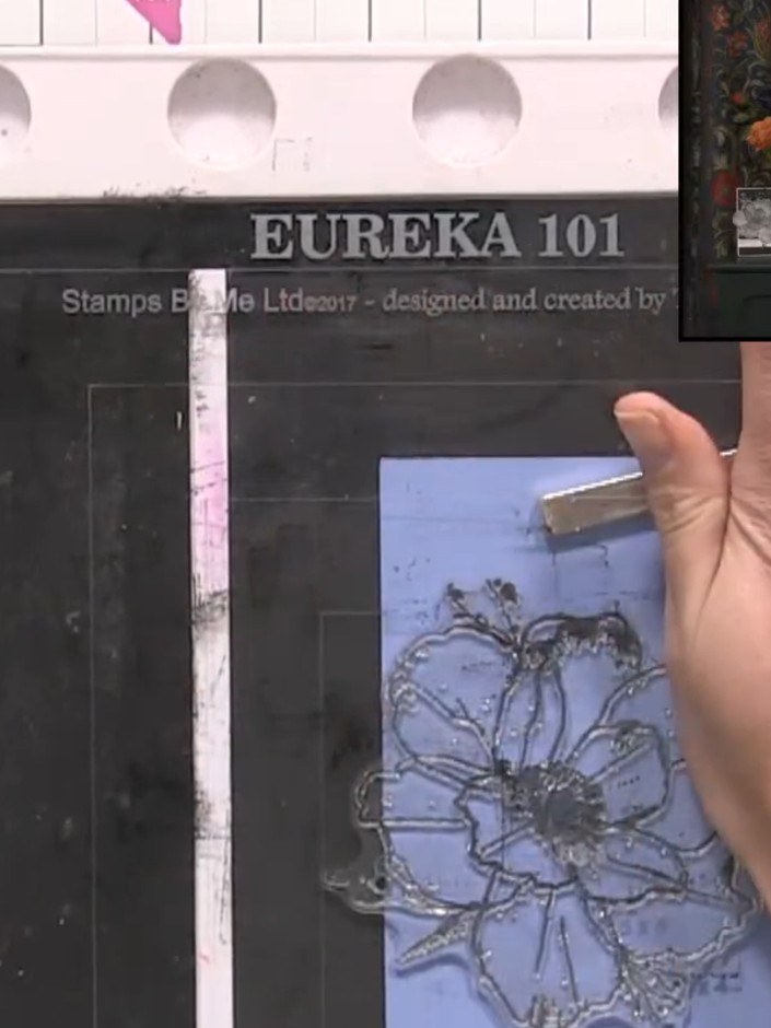Step 6: Stamp the poppy image onto the blue card stock using black ink. Re-ink the stamp if needed to achieve a darker