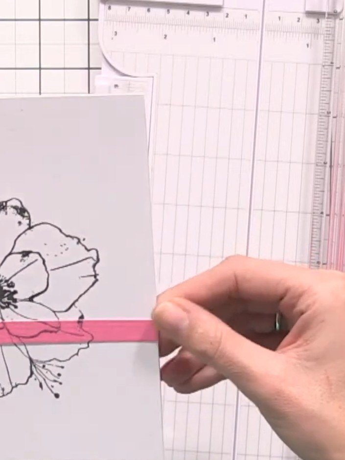 Step 5: Position the second pink strip directly below the first strip, aligning it so the poppy design continues seaml