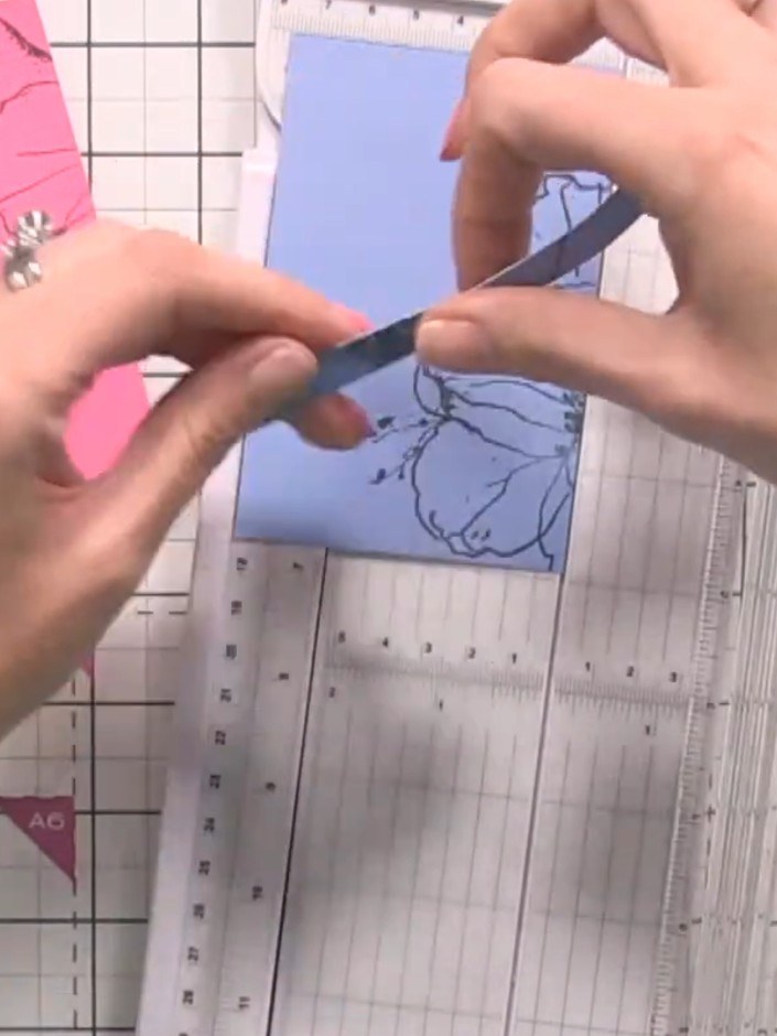 Step 8: Stamp a sentiment from the stamp set onto the card front using black ink.