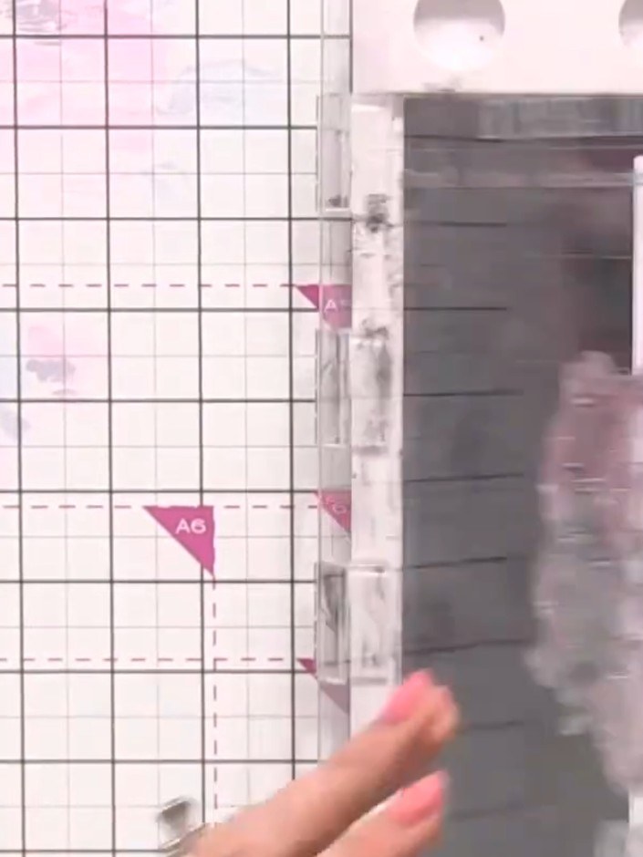 Step 10: Using a trimmer or craft knife with a ruler, trim the assembled card to create clean, straight edges. Ensure a