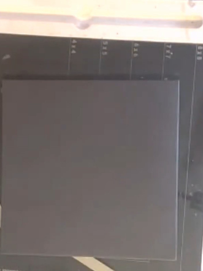 Step 2: Place a piece of black card onto your stamping platform. Using a flat brush, apply silver metallic watercolour
