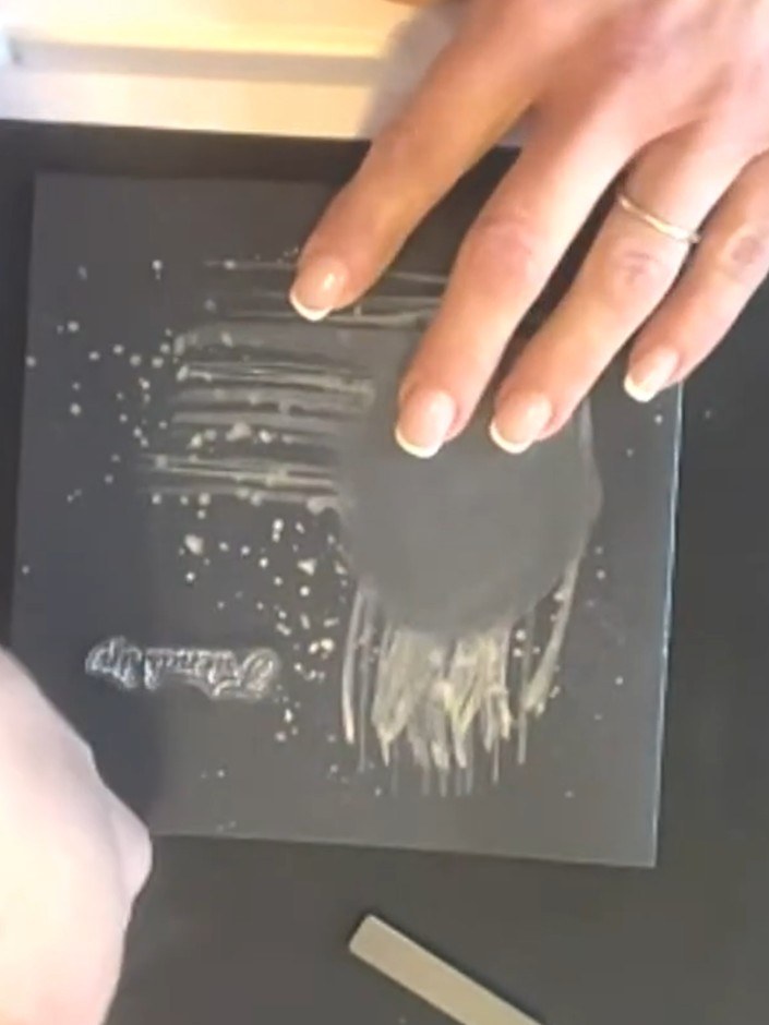 Step 7: Stamp a sentiment from the Songbird stamp set onto the black card base. Heat emboss the stamped sentiment usin