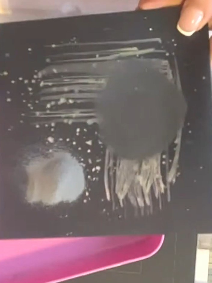 Step 8: Use your heat tool to heat set the embossed sentiment on the black card, bringing the embossing powder to its 
