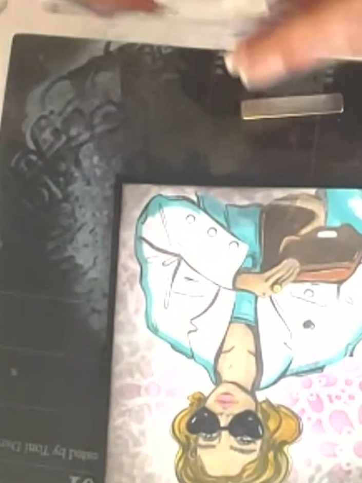 Step 13: Mat the coloured girl image onto black card. This creates a border that makes the image pop against the patter