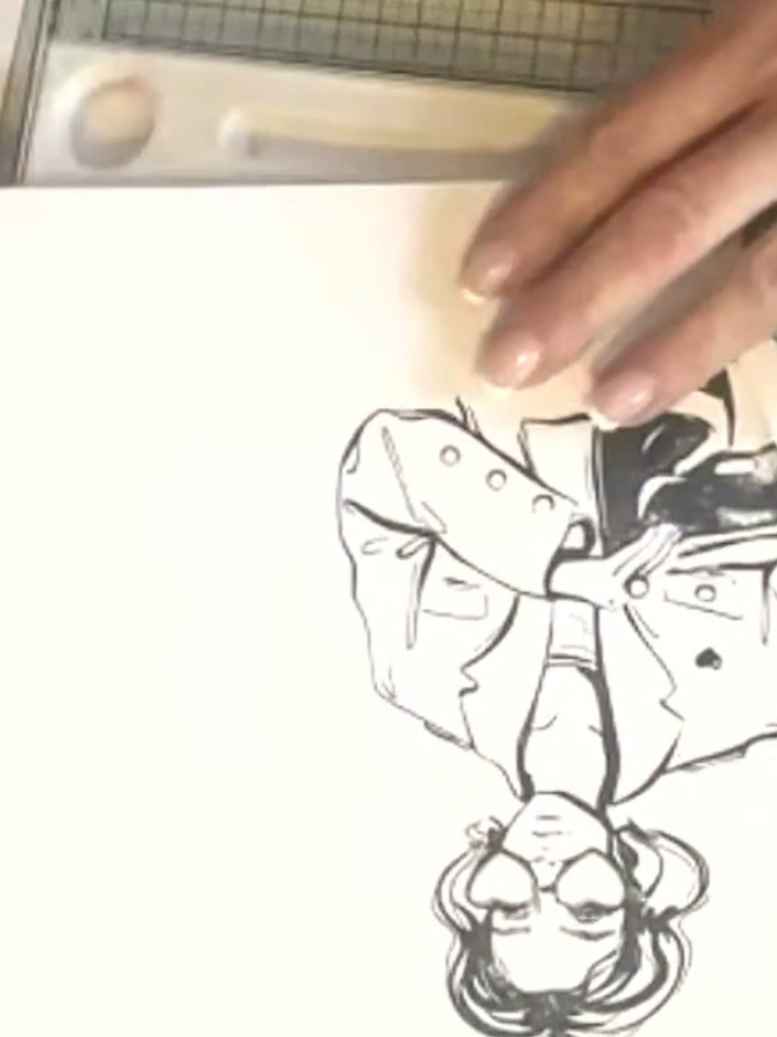 Step 2: Using a darker alcohol marker, lightly outline and shade the girl's features, focusing on areas like the cheek