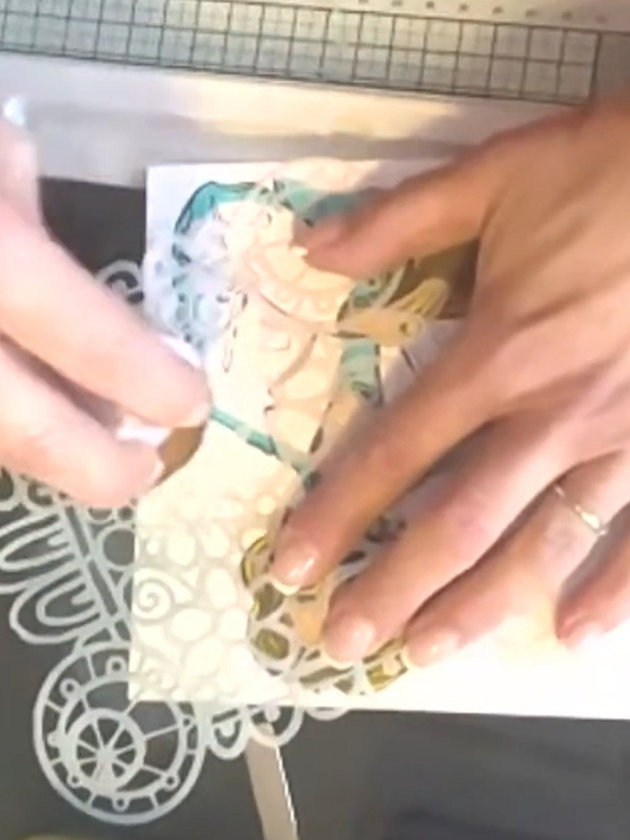 Step 7: Stamp the girl image onto decorative patterned paper that coordinates with your background. Colour around the 