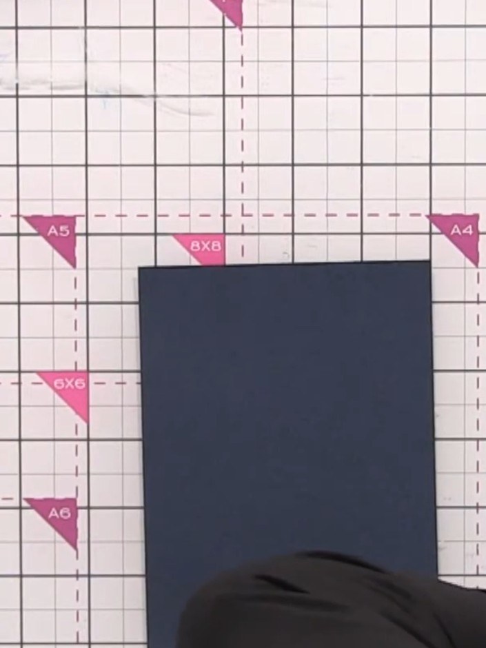 Step 3: Place the navy card stock on your craft mat. Use an antistatic bag to prepare the surface, then apply the Fore