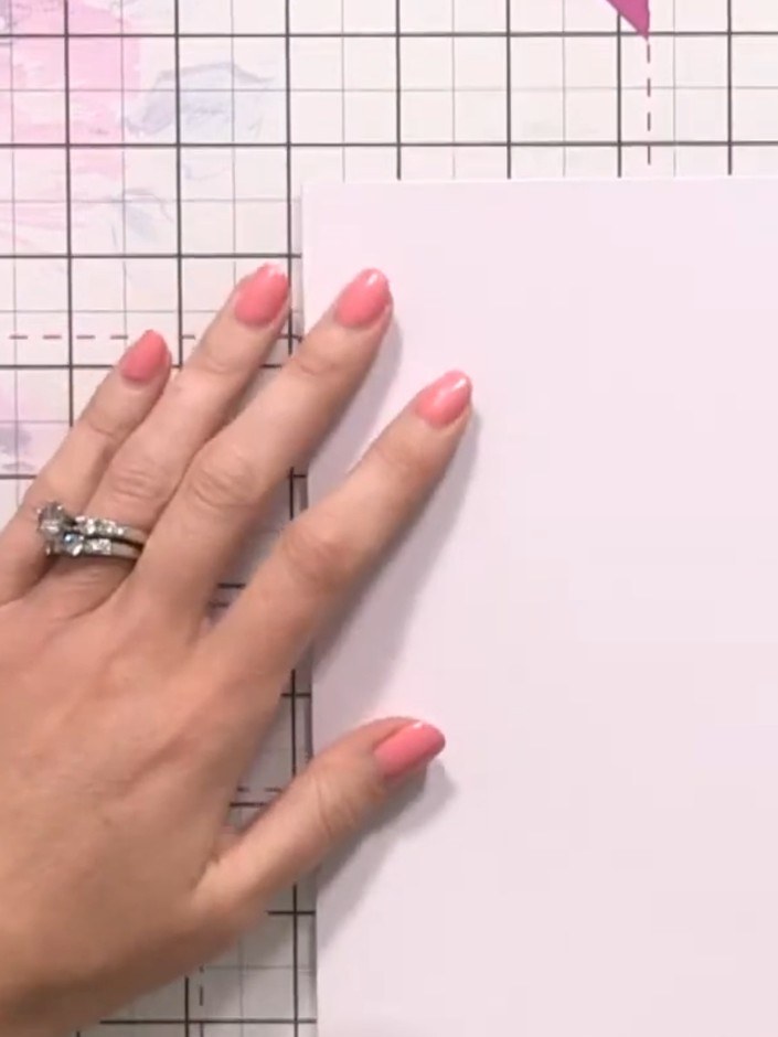Step 1: Cut a side-folding card blank in half and score it to create a top-folding note card. Tape the cut piece insid