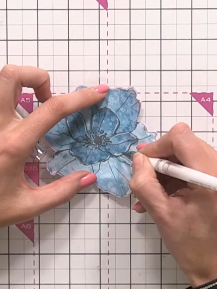 Step 13: Use a white gel pen to add highlights along the flower petal lines, bringing back detail and definition where 