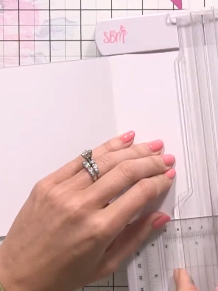 Step 2: Using a paper trimmer, cut the front of your card blank into 1-inch strips, leaving a small section at the top