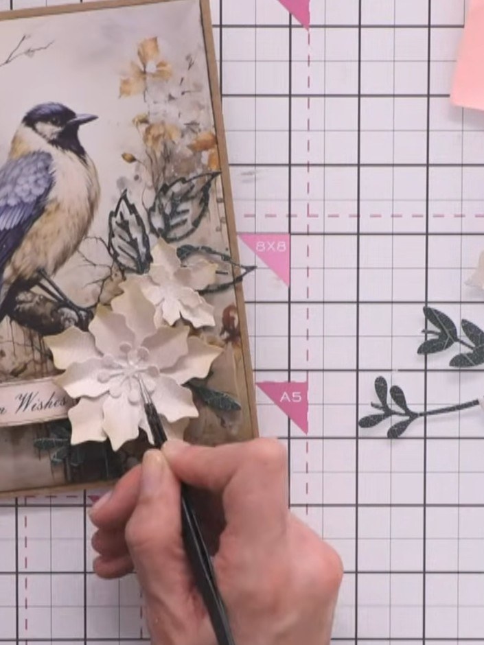 Step 12: Ensure all decorative elements are securely adhered to the card. Allow all glue to dry completely before your 