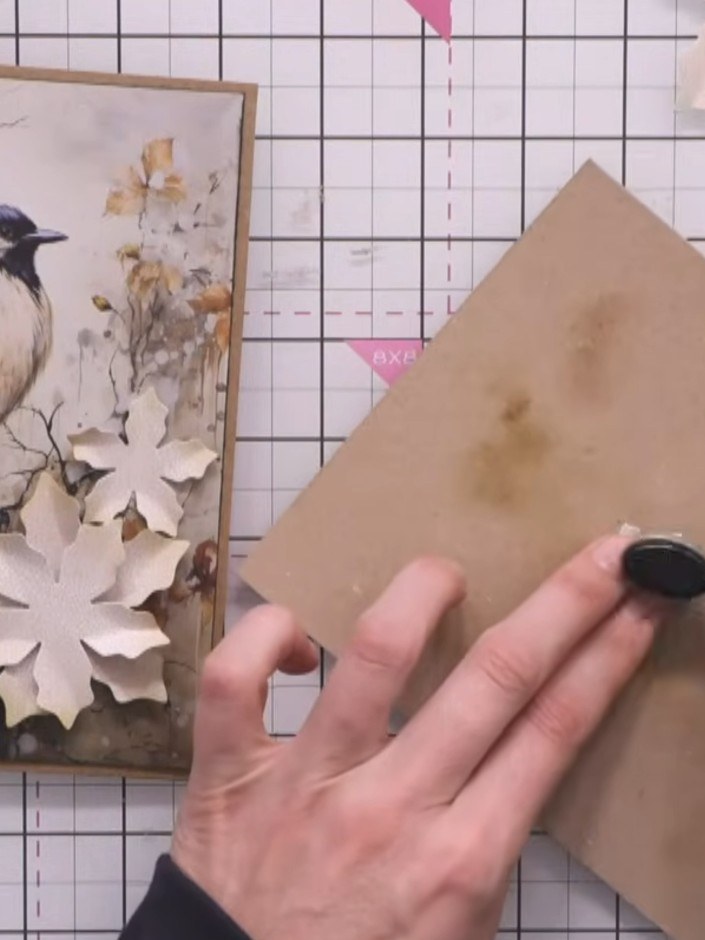 Step 2: Take a kraft-coloured cardstock square and position it on the front of your card blank to check the placement.